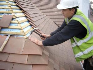 Virginia-Based-Roofing-Repair-Contractors-In-Action-On-top-Of-Roof